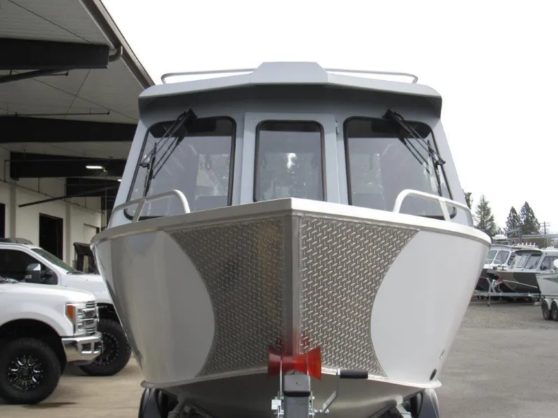 Slide: The Image of 2024 Hewescraft 220 OCEAN PRO HT FC boat front view at dealership. - 8