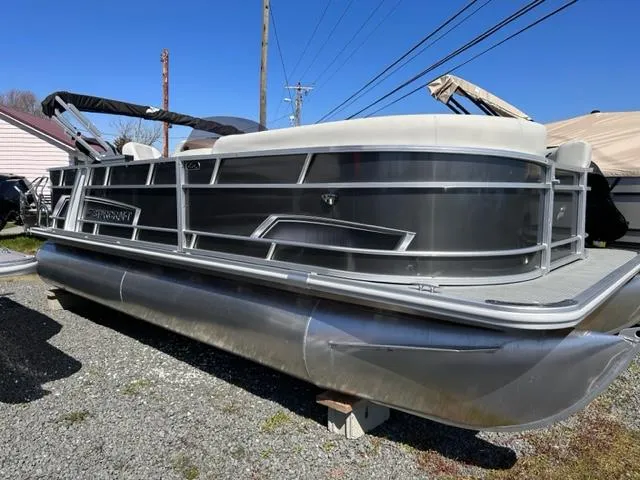The Image of 2024 Starcraft EX 20 C pontoon boat with sleek silver design. - 0