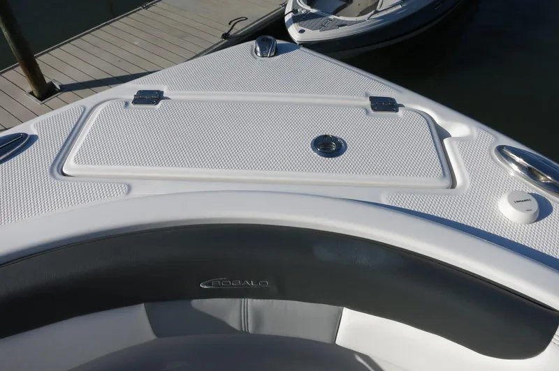 Slide: The Image of Bow seating area of 2024 Robalo 222 Explorer CC boat at dock. - 11
