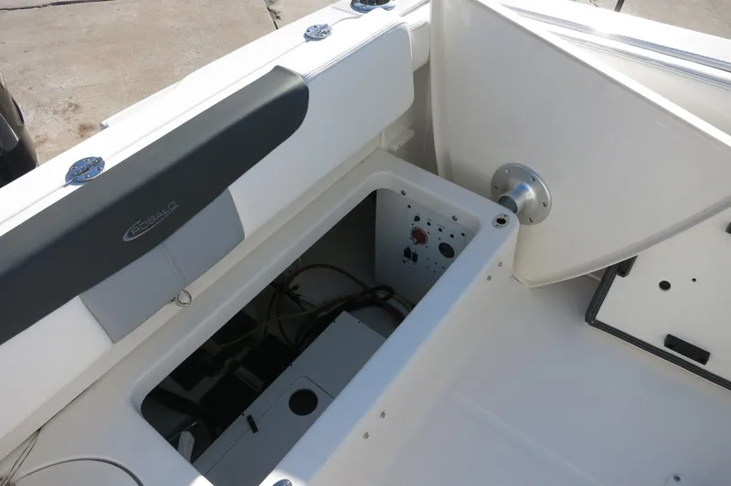 Slide: The Image of 2024 Robalo 222 Explorer CC boat storage compartment and seating area. - 33