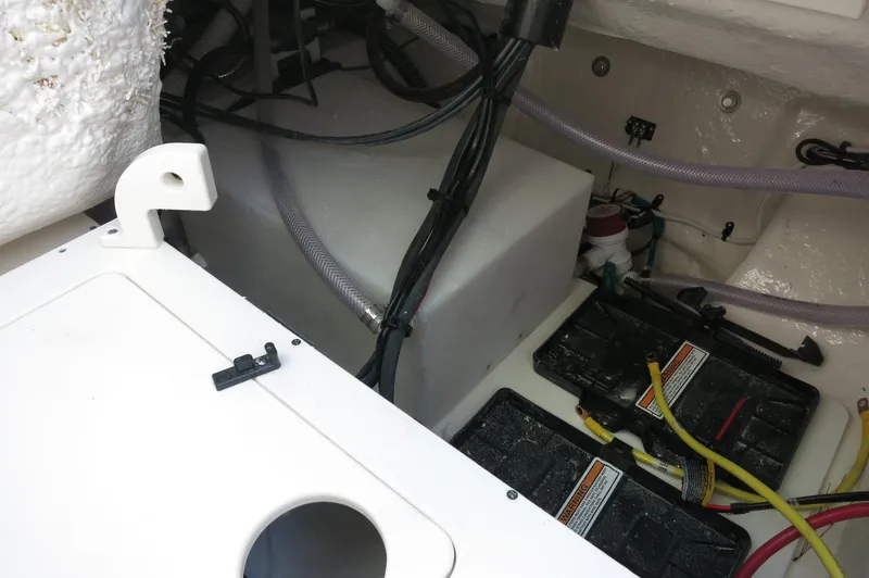 Slide: The Image of 2024 Robalo 222 Explorer CC boat battery and wiring compartment. - 36