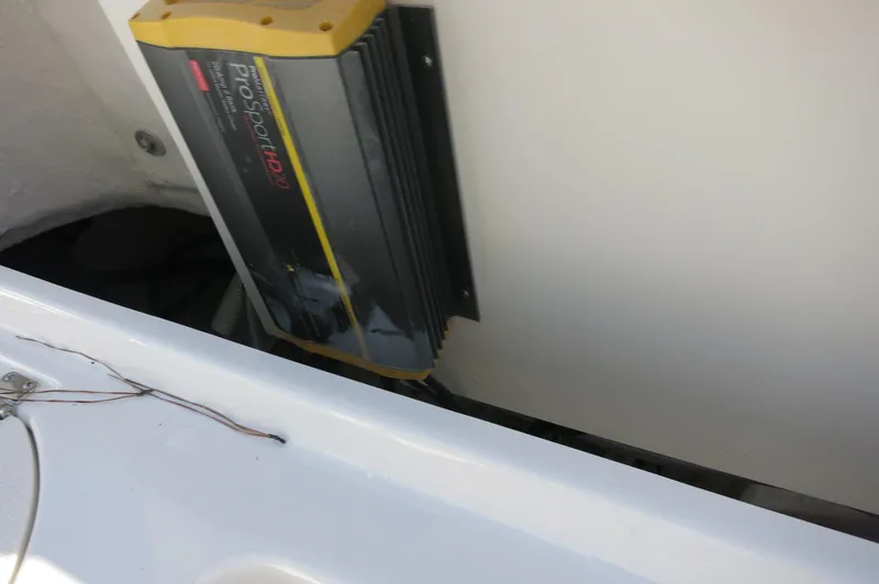 Slide: The Image of Battery charger in the 2024 Robalo 222 Explorer CC boat. - 38