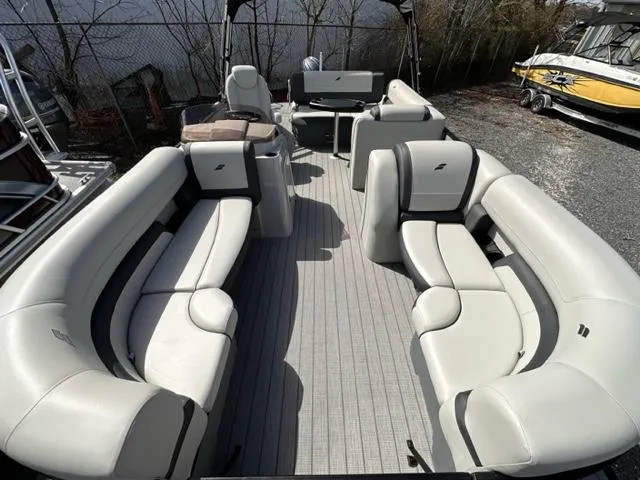 Slide: The Image of 2024 Starcraft EX 20 Q DH pontoon boat with spacious seating and modern design. - 2