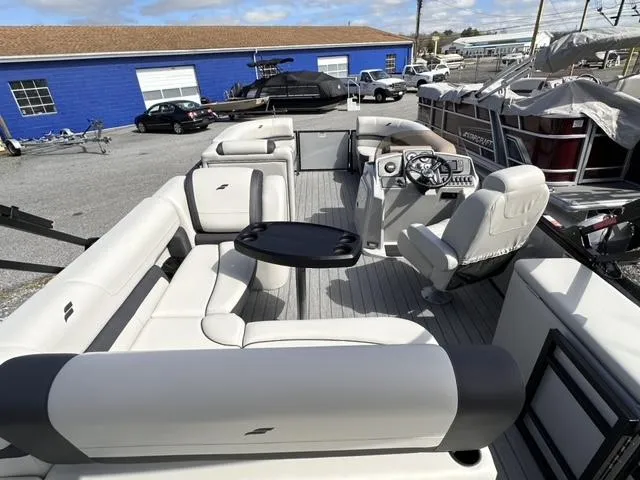 Slide: The Image of 2024 Starcraft EX 20 Q DH pontoon boat with spacious seating and modern helm. - 3