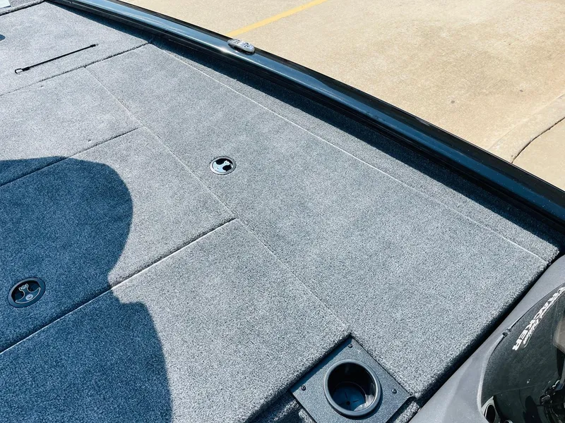 Slide: The Image of 2024 Tracker Pro Team 195 TXW Tournament Edition boat deck with storage compartments. - 16