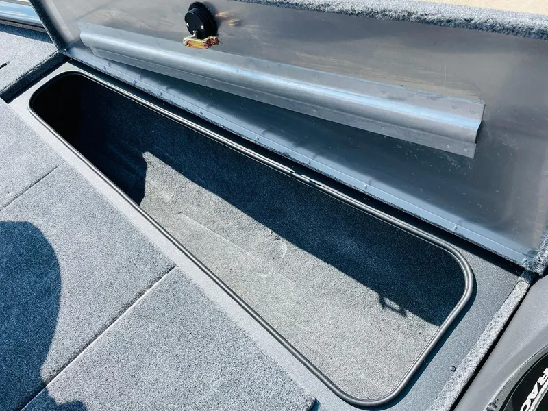 Slide: The Image of 2024 Tracker Pro Team 195 TXW Tournament Edition storage compartment. - 17