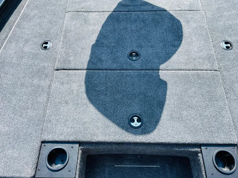 Slide: The Image of 2024 Tracker Pro Team 195 TXW Tournament Edition boat deck with storage compartments. - 19