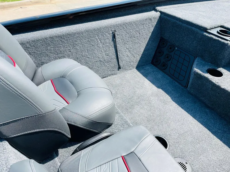 Slide: The Image of 2024 Tracker Pro Team 195 TXW Tournament Edition boat interior with gray seats. - 24