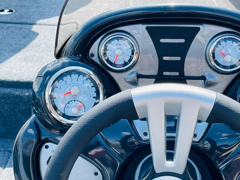 Slide: The Image of Close-up of the dashboard and steering wheel of a 2024 Tracker Pro Team 195 TXW Tournament Edition boat. - 27