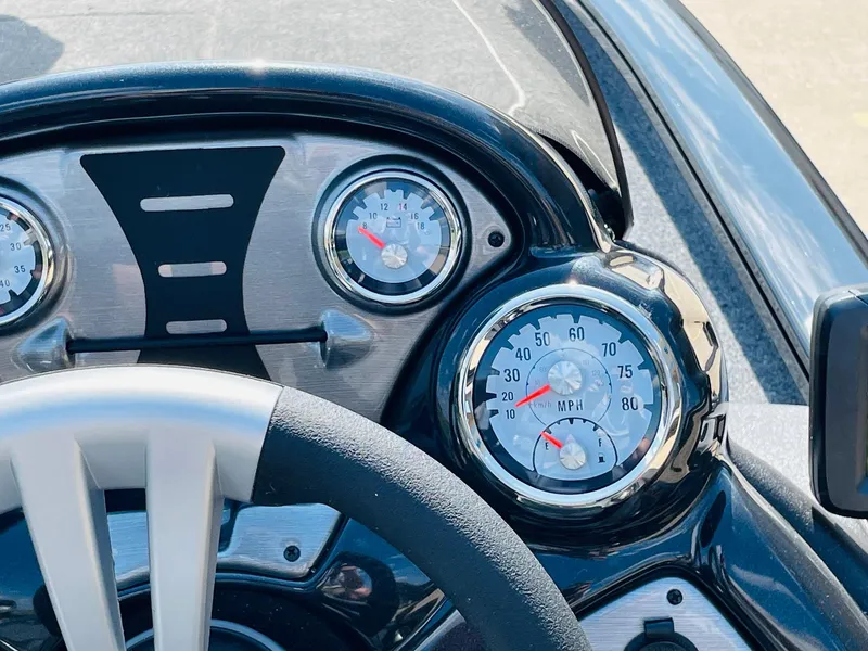 Slide: The Image of 2024 Tracker Pro Team 195 TXW Tournament Edition boat dashboard with speedometer and gauges. - 28