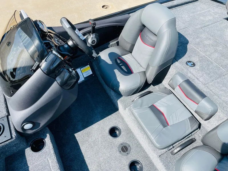 Slide: The Image of 2024 Tracker Pro Team 195 TXW Tournament Edition boat interior with steering console and seating. - 32