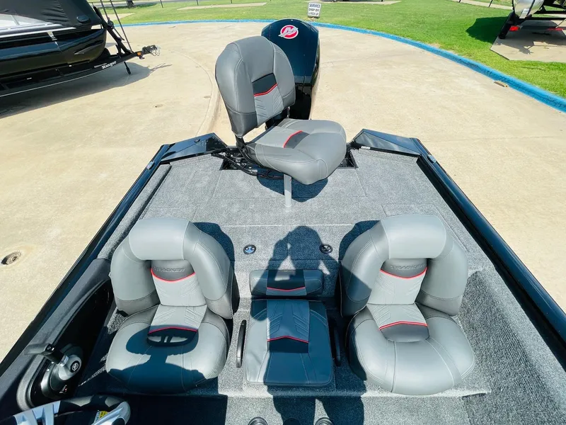 Slide: The Image of 2024 Tracker Pro Team 195 TXW Tournament Edition boat with gray seating and spacious deck. - 35