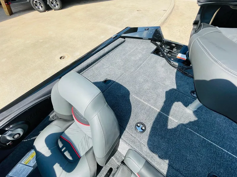 Slide: The Image of 2024 Tracker Pro Team 195 TXW Tournament Edition boat interior with gray seats and carpet. - 36