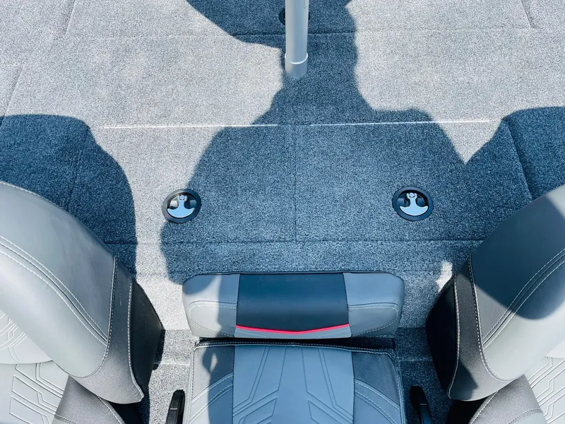 Slide: The Image of 2024 Tracker Pro Team 195 TXW Tournament Edition boat interior with gray seats and carpet. - 38