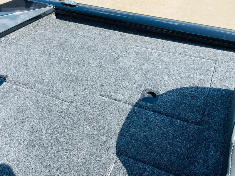 Slide: The Image of 2024 Tracker Pro Team 195 TXW Tournament Edition boat deck with gray carpet. - 40