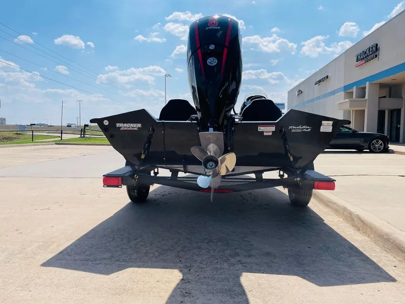 Slide: The Image of 2024 Tracker Pro Team 195 TXW Tournament Edition boat rear view at dealership. - 6
