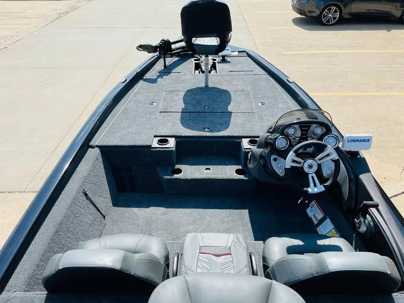 Slide: The Image of 2024 Tracker Pro Team 195 TXW Tournament Edition fishing boat interior with steering console and seating. - 8