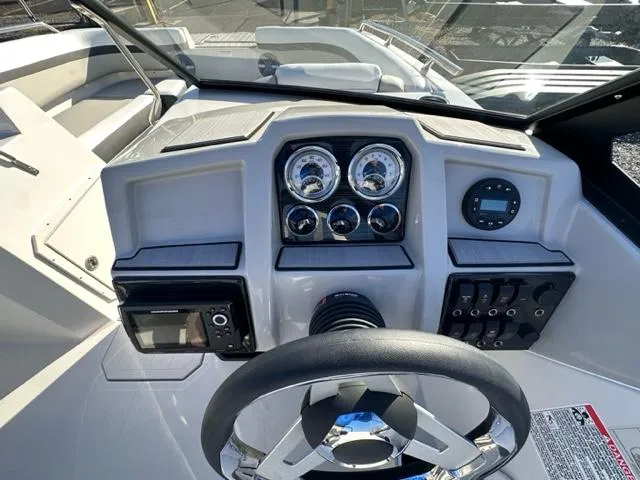 Slide: The Image of 2024 Starcraft SVX 190 boat dashboard with steering wheel and control panel. - 3