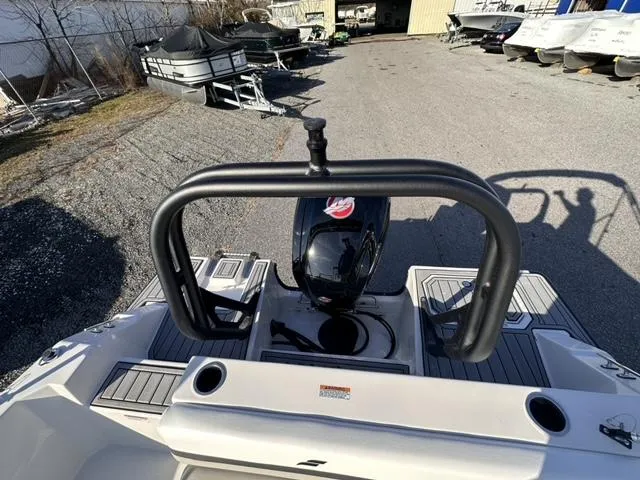 Slide: The Image of 2024 Starcraft SVX 190 boat rear view with outboard motor and swim platform. - 4