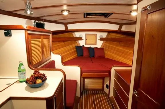 Slide: The Image of Luxurious cabin interior of 2005 John Williams Custom 38 yacht with cozy bedding and wooden finishes. - 6
