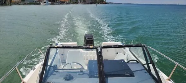 Slide: The Image of 1994 Bayliner Trophy boat cruising on clear blue water. - 3