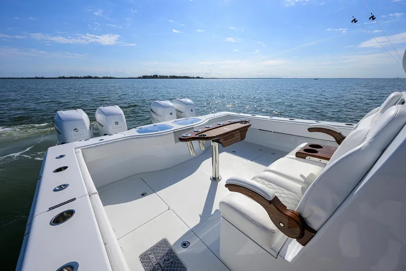 Slide: The Image of 2022 Freeman Center Console boat with quad engines on open water. - 12