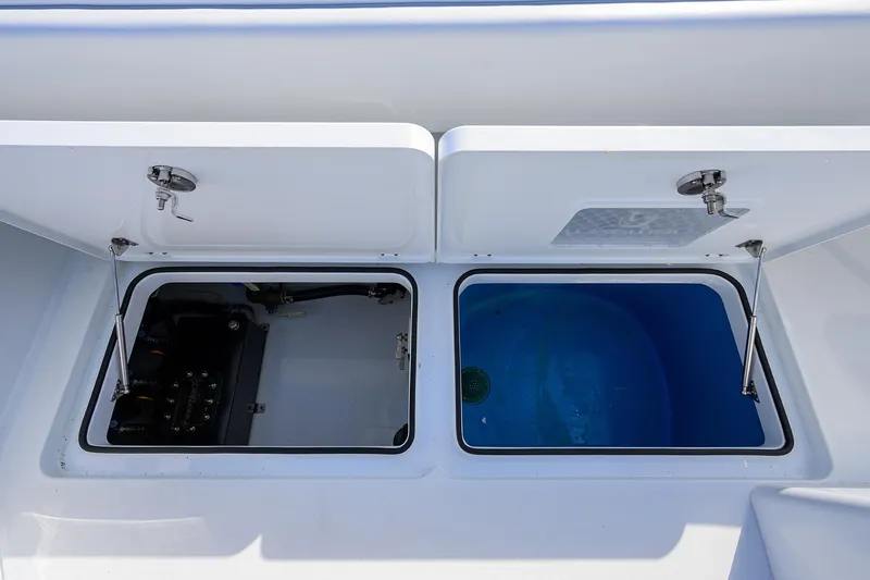 Slide: The Image of 2022 Freeman Center Console boat storage compartments. - 17