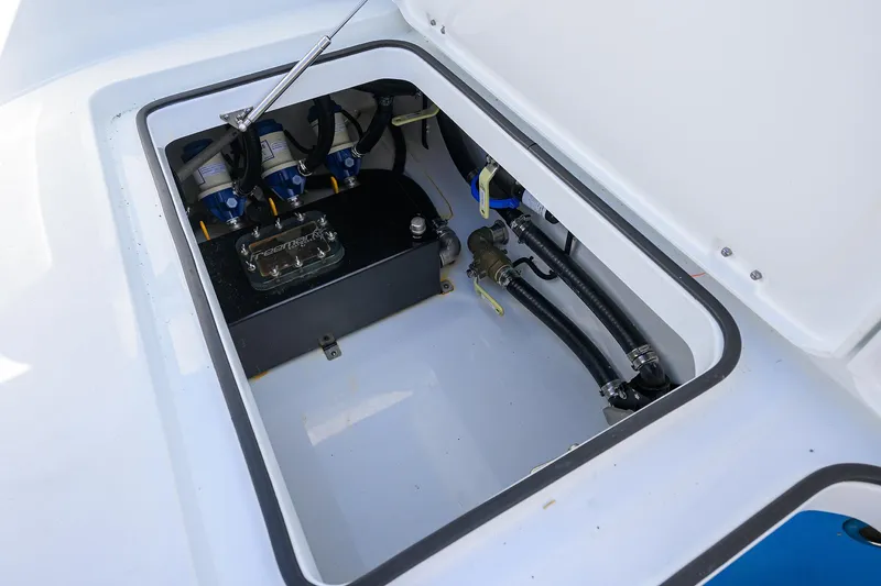 Slide: The Image of 2022 Freeman Center Console boat battery compartment and wiring. - 18