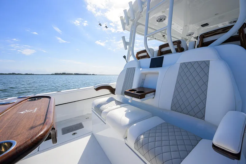 Slide: The Image of 2022 Freeman Center Console boat with luxurious seating and ocean view. - 19
