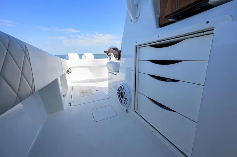 Slide: The Image of 2022 Freeman Center Console boat interior with storage drawers and seating. - 21