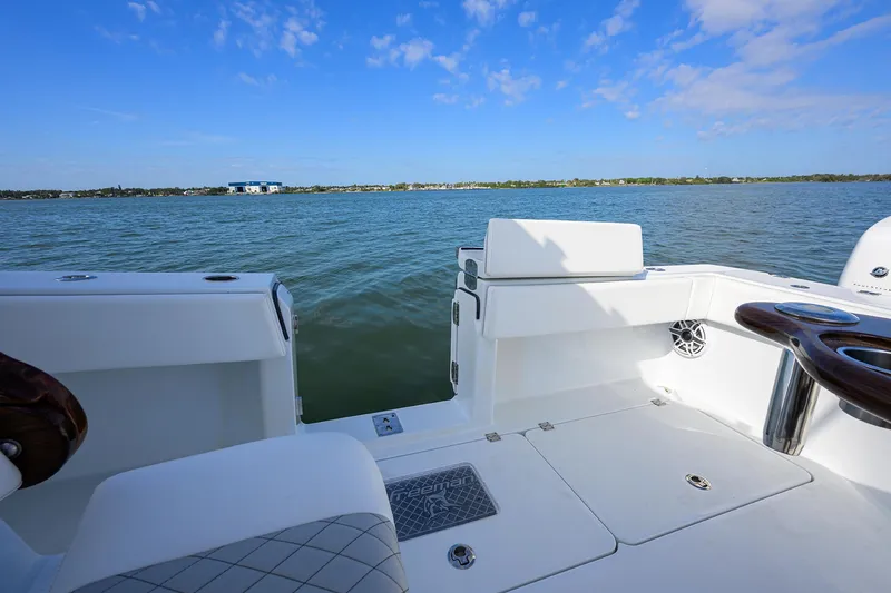 Slide: The Image of 2022 Freeman Center Console boat on calm water with clear blue sky. - 23