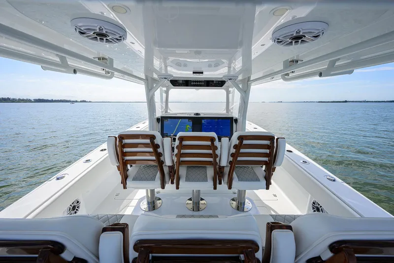 Slide: The Image of 2022 Freeman Center Console boat with wooden seats and advanced navigation system. - 31