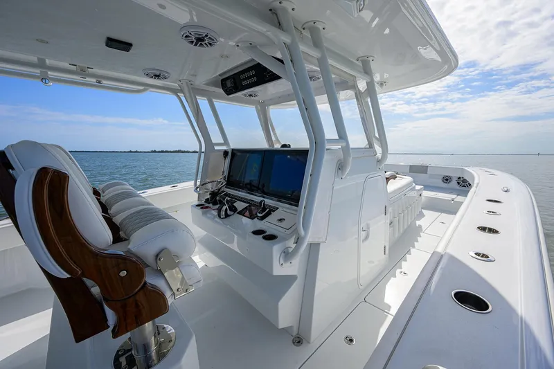 Slide: The Image of 2022 Freeman Center Console boat with advanced navigation system on open water. - 34