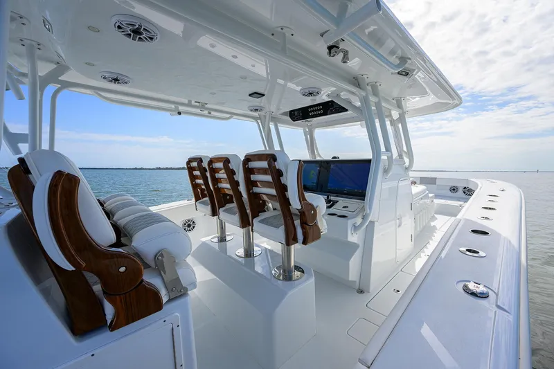 Slide: The Image of 2022 Freeman Center Console boat interior with luxurious seating and advanced navigation system. - 35
