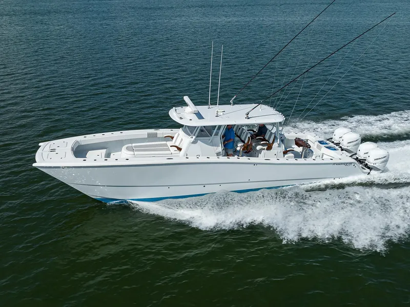 Slide: The Image of 2022 Freeman Center Console boat cruising on open water. - 38