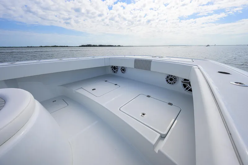 Slide: The Image of 2022 Freeman Center Console boat interior with storage compartments and ocean view. - 6