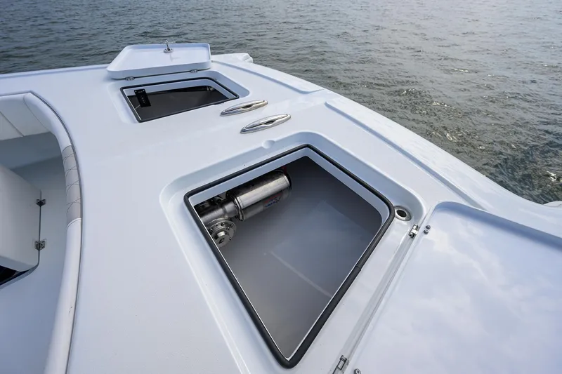 Slide: The Image of 2022 Freeman Center Console boat with open storage compartments on deck. - 7
