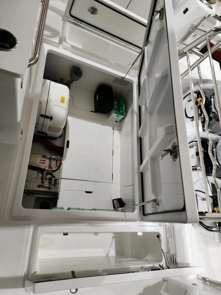 Slide: The Image of 2024 Wellcraft 355 Commuter engine compartment with open hatch. - 13