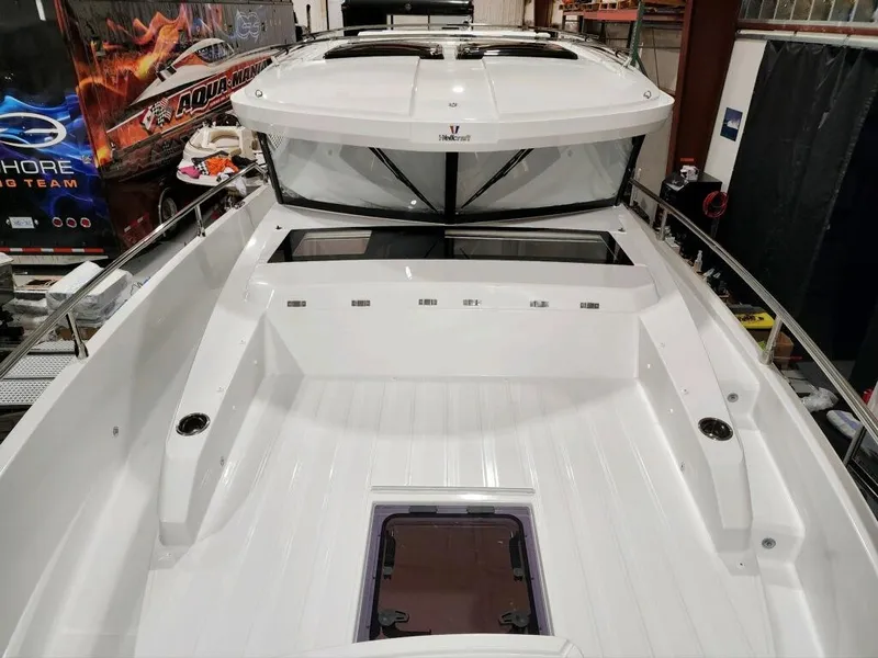 Slide: The Image of 2024 Wellcraft 355 Commuter boat interior, spacious deck, modern design. - 16