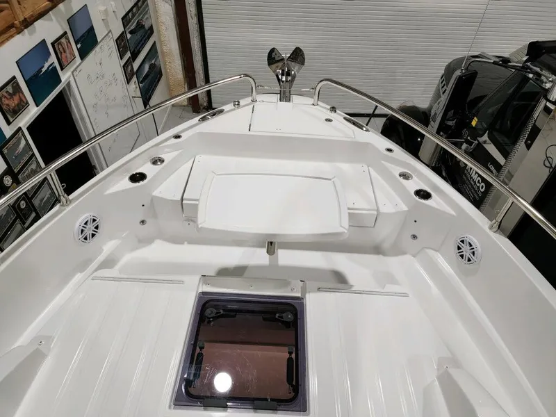 Slide: The Image of 2024 Wellcraft 355 Commuter boat deck with stainless steel railings and hatch. - 18