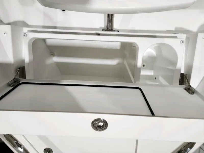 Slide: The Image of 2024 Wellcraft 355 Commuter storage compartment with open hatch. - 22