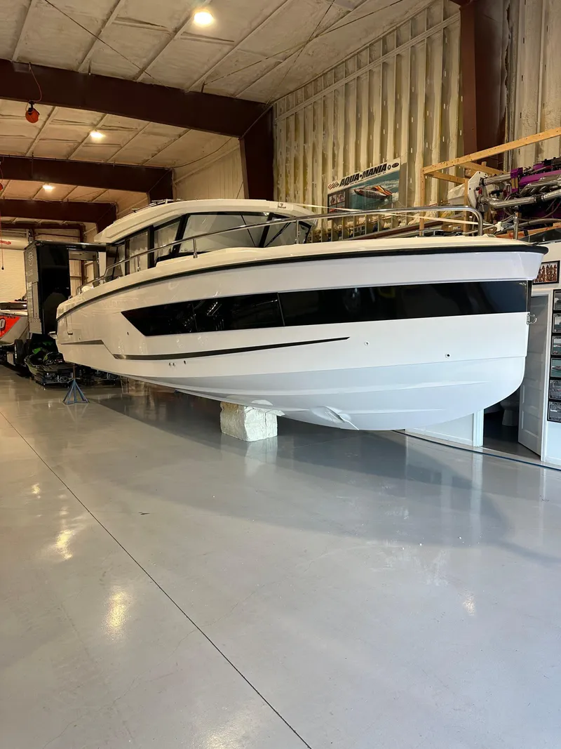 Slide: The Image of 2024 Wellcraft 355 Commuter boat in a showroom. - 3