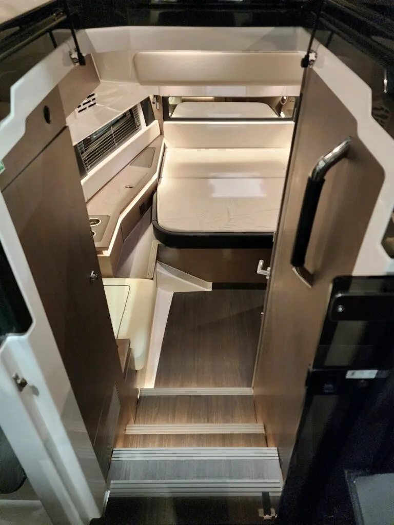 Slide: The Image of 2024 Wellcraft 355 Commuter interior cabin with modern design and wooden finishes. - 38