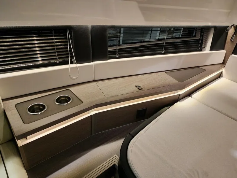 Slide: The Image of Interior of 2024 Wellcraft 355 Commuter boat with modern seating and cup holders. - 41