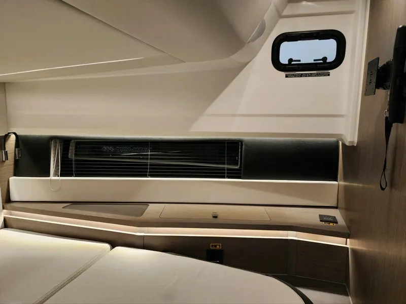 Slide: The Image of 2024 Wellcraft 355 Commuter interior cabin with modern design and window. - 45