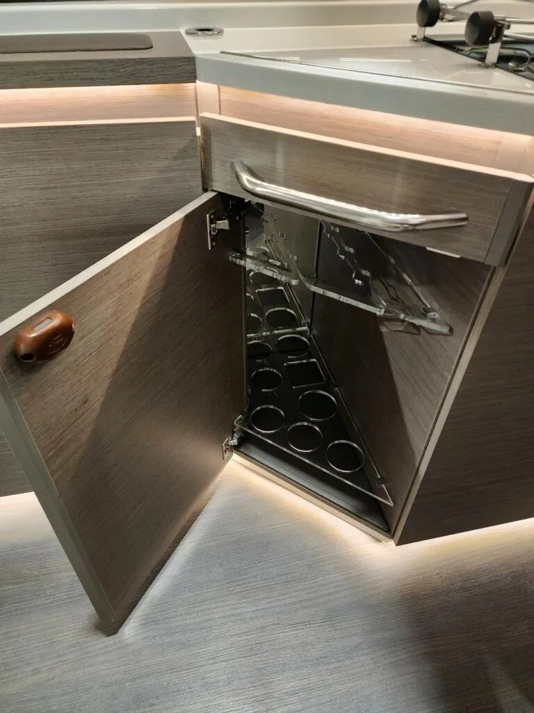 Slide: The Image of 2024 Wellcraft 355 Commuter interior cabinet with built-in bottle storage. - 48