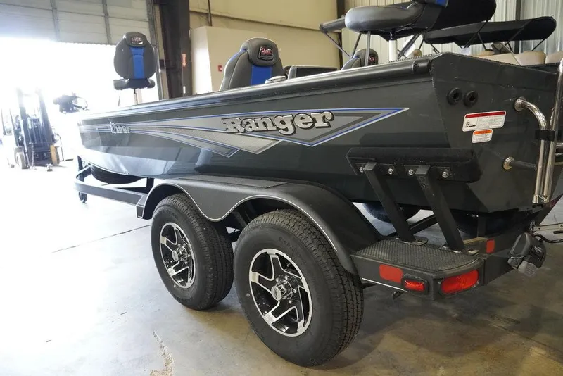 Slide: The Image of 2024 Ranger RT198P fishing boat on trailer in a garage. - 4