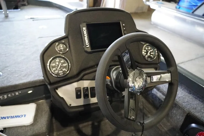 Slide: The Image of 2024 Ranger RT198P boat dashboard with Lowrance electronics and steering wheel. - 6