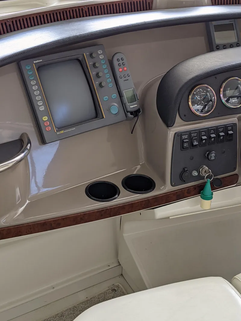 Slide: The Image of Control panel of a 2000 Carver 506 Motor Yacht with navigation equipment. - 12