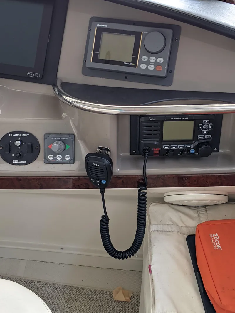 Slide: The Image of Control panel of a 2000 Carver 506 Motor Yacht with navigation and communication equipment. - 14